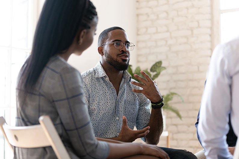 A client speaking with a mental health care professional