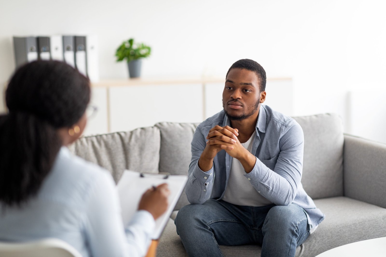 Mental health professional meeting with a client